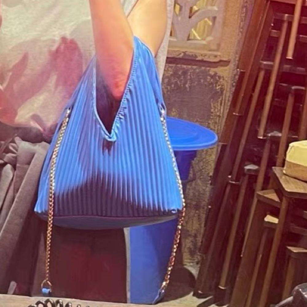 Bright blue leather trendy tote bag with pleat
